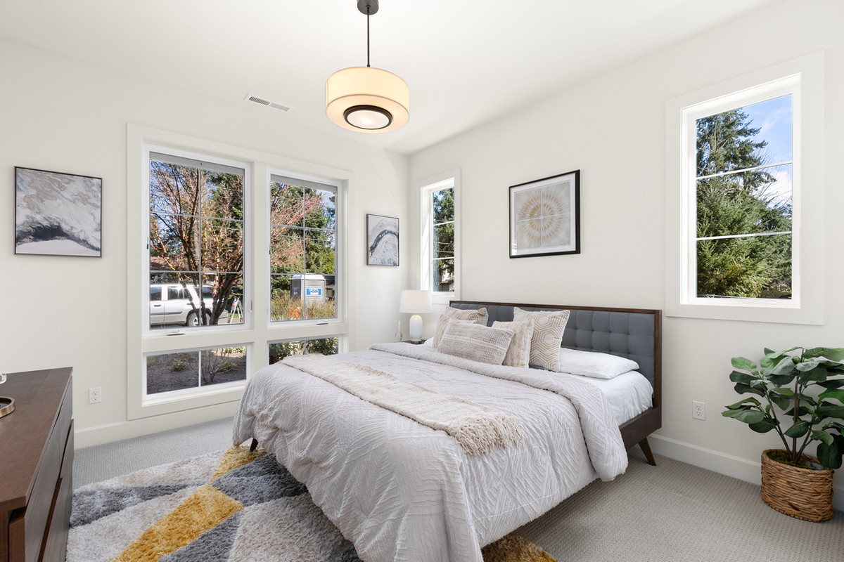 The same bedroom, styled by Evolve around the existing bed
